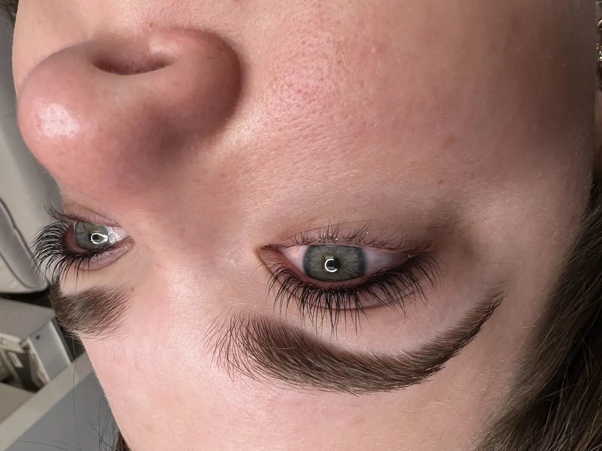 Freshly microbladed brows with fine, natural hair strokes