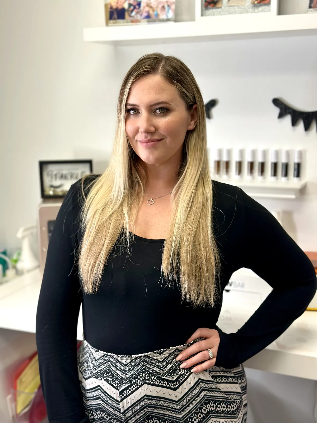Caila, owner of Beauty Fetish, smiling in her suite