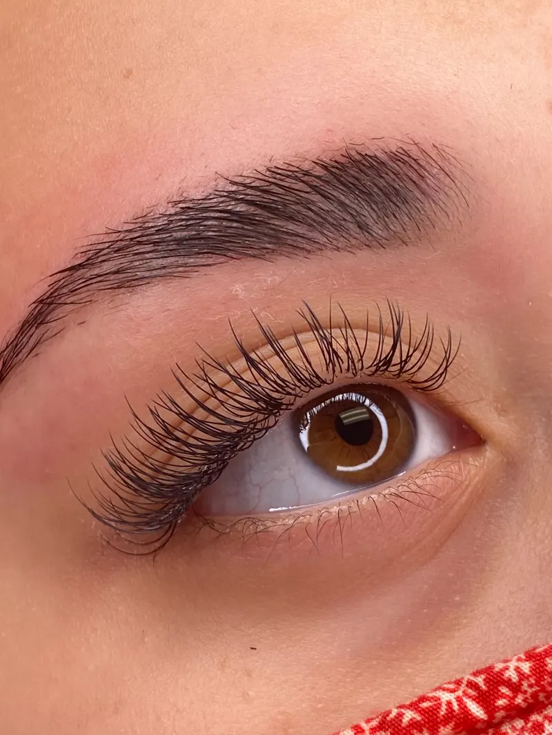 Close up of a client's eye with a full set of eyelash extensions by Caila
