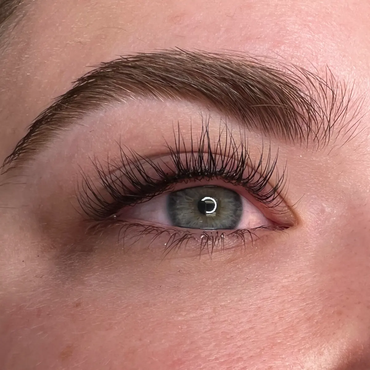 A finished set of eyelash extensions, full and feathery